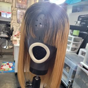 100%  Brazilian lace front wig. This wig has 1B dark roots and blonde tips. 12in